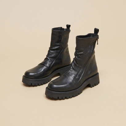 Boots with zips and notched soles in black aged leather | ROLIN