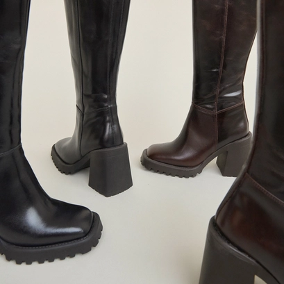 High boots with notched soles and square toes in black leather | GENE