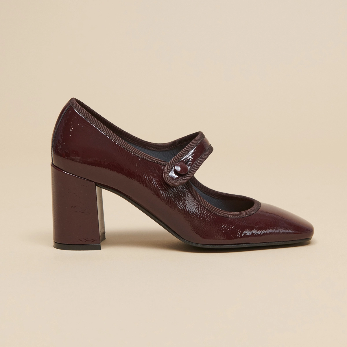 Heeled babies with big buckle straps in black pleated patent leather | DRANCY
