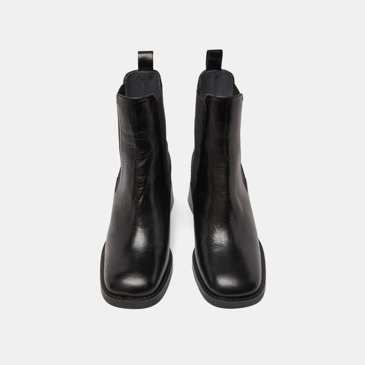 Ankle boots with elastics and chunky heels in black leather | DUCK