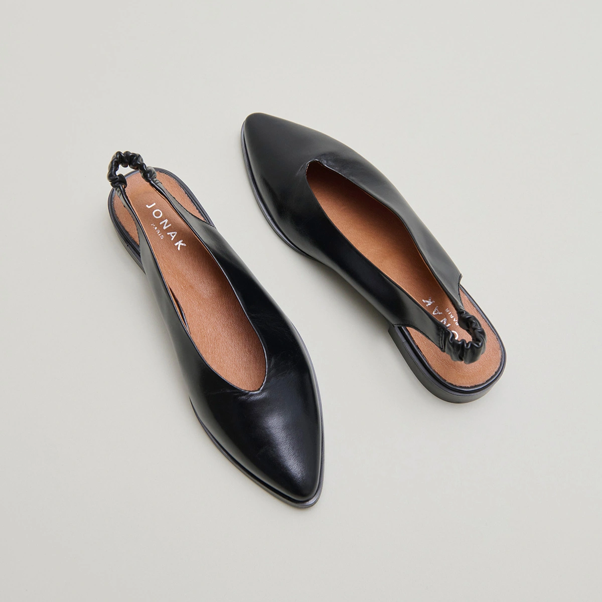 Ballet flats with open backs in black leather | ACAJOU