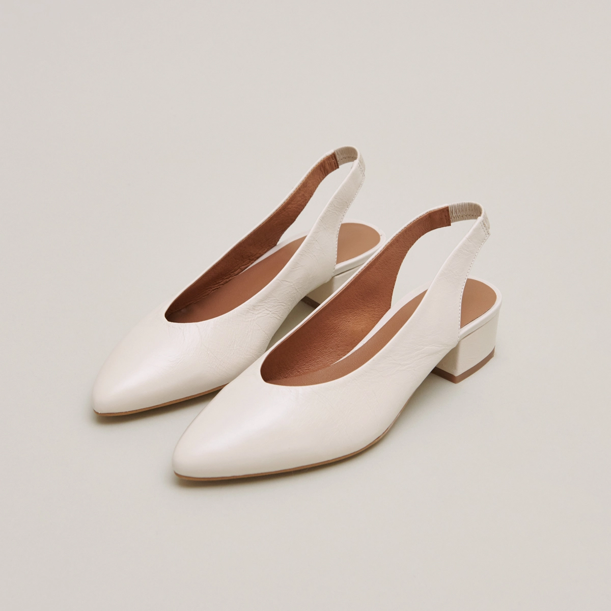Ballet flats with open backs in ecru distressed leather | VINCE