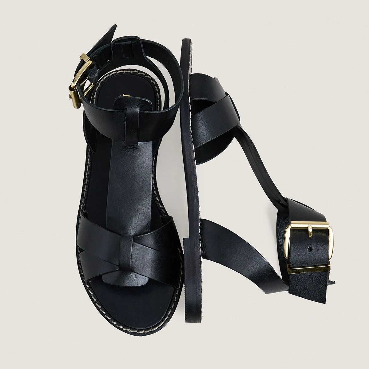 Buckle and strap sandals in black leather | WHISPER
