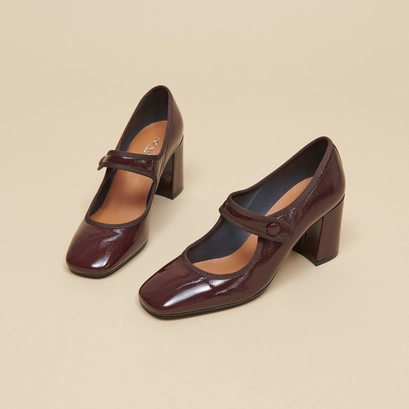 Heeled babies with big buckle straps in black pleated patent leather | drancy