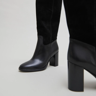 Heeled boots in black suede and black leather | down