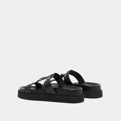Platform sandals in black glazed leather | luana