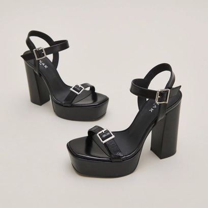 High-heeled sandals and platforms in black leather | BONHEUR