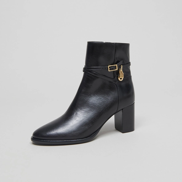 Ankle boots with high heels and gold charms in black leather | DRAME