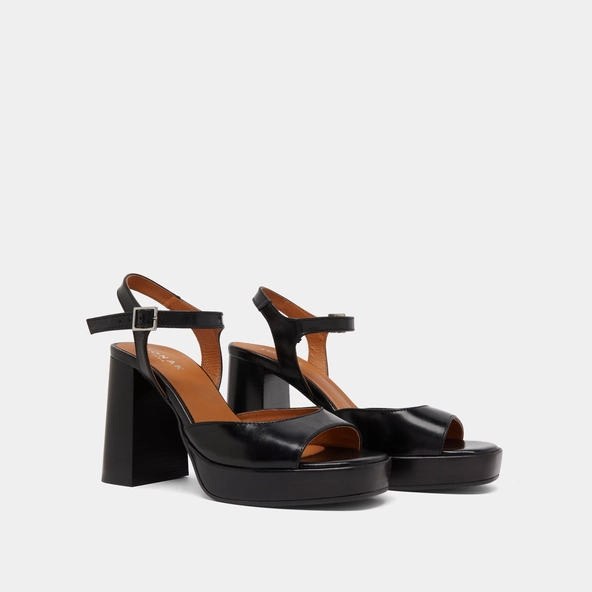 High-heeled sandals and platforms in black leather | BAMBA