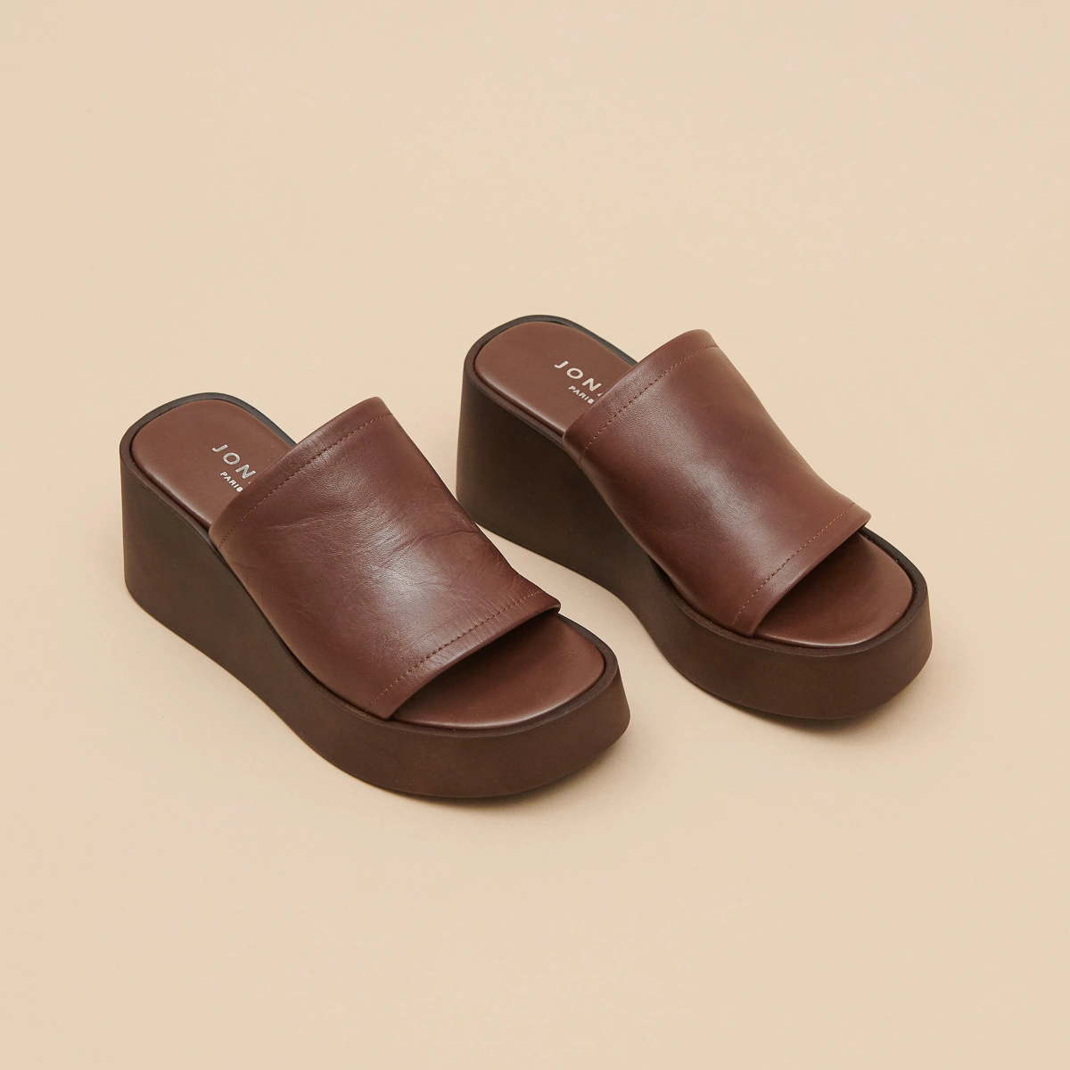 Wedge mules in dark brown leather | EUGENE