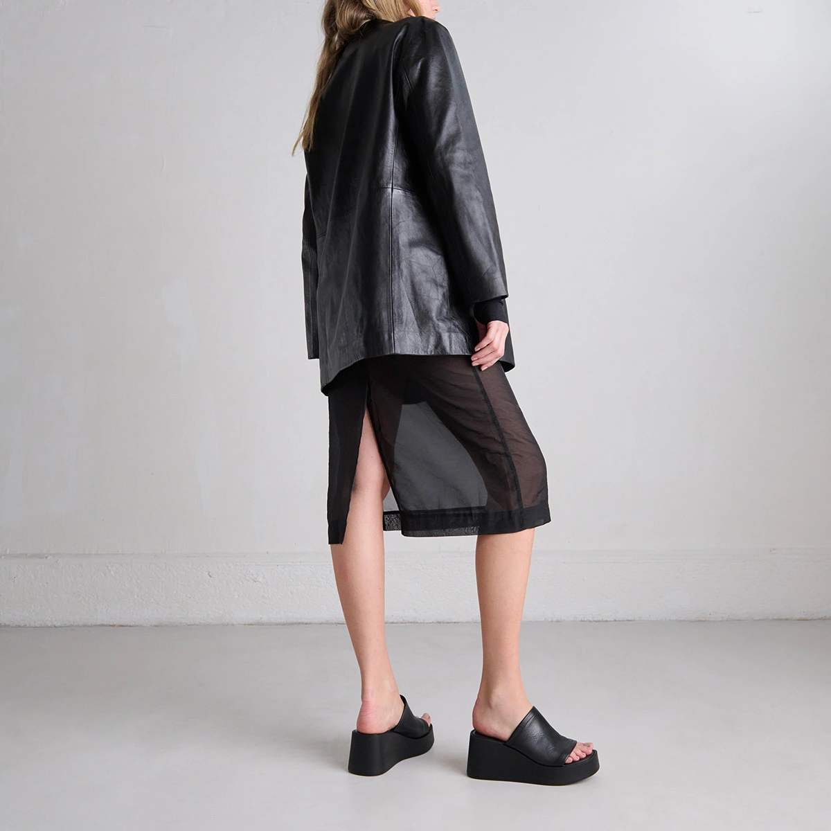 Wedge mules in black leather | EUGENE
