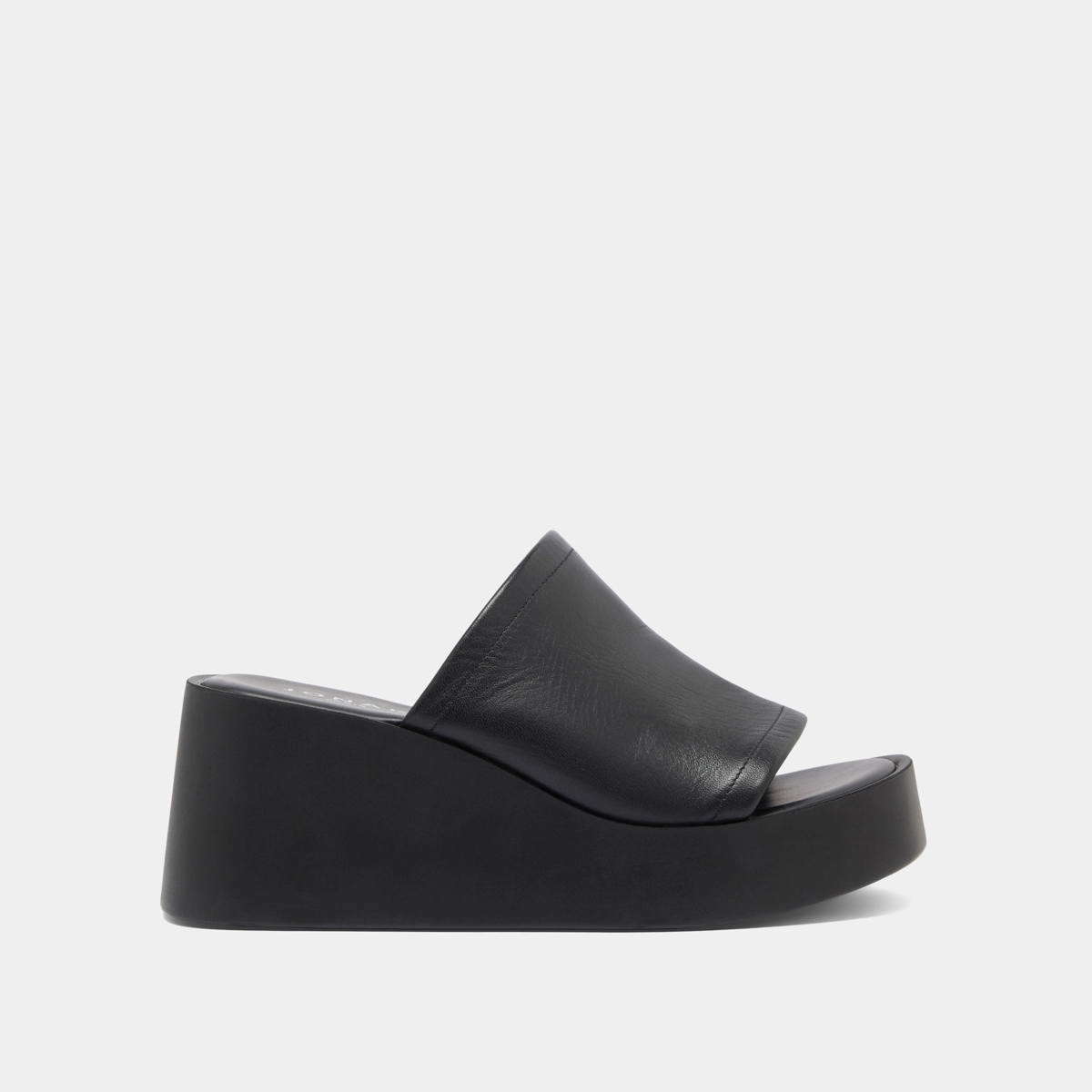 Wedge mules in black leather | EUGENE