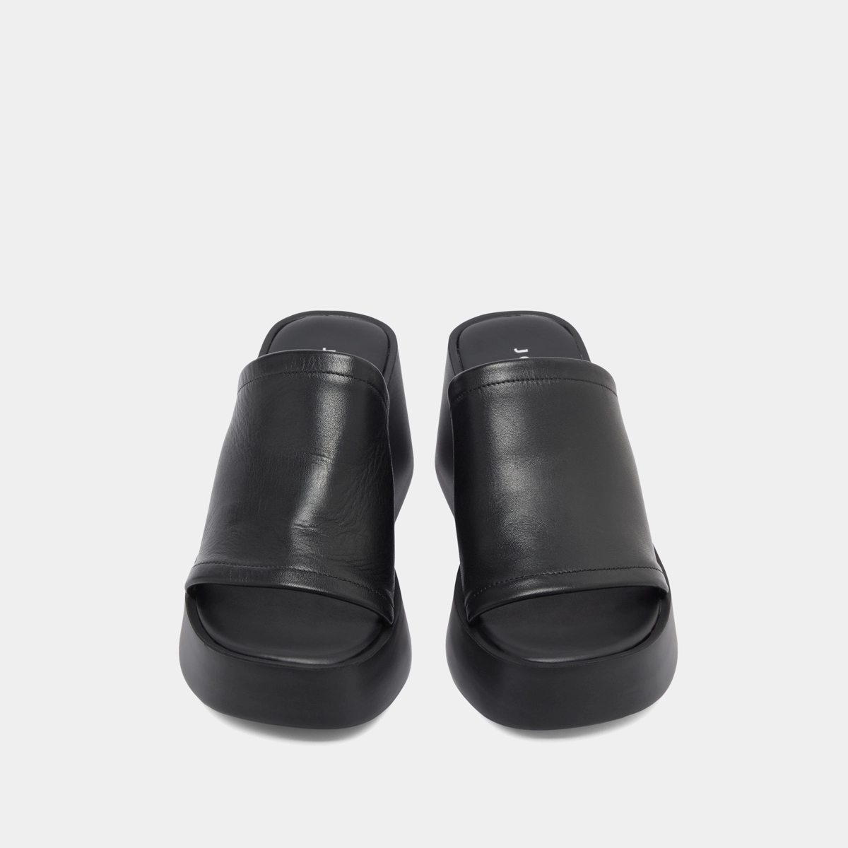 Wedge mules in black leather | EUGENE