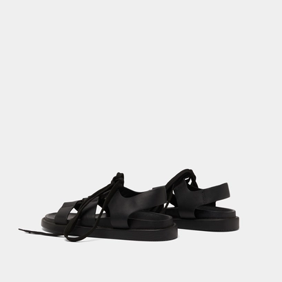 Sandals with multiple straps and laces in black leather | wellington