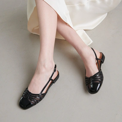 Ballet flats with open backs in black pleated patent and mesh | DESIRE
