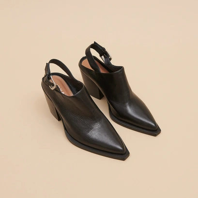Mules with beveled heels in black leather | doren