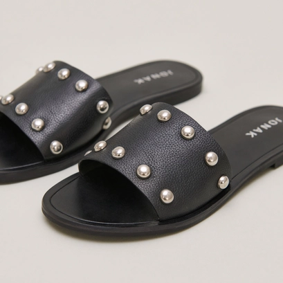 Mules with silver details in black grained leather | winslow