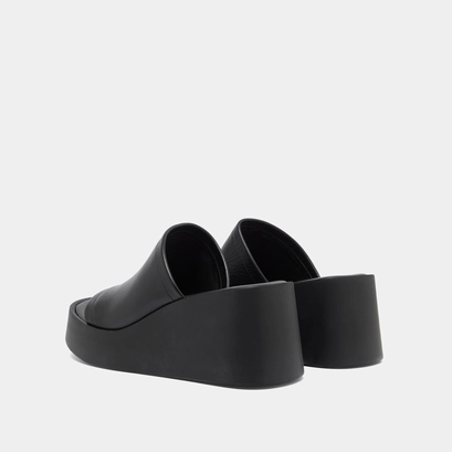 Wedge mules in black leather | eugene