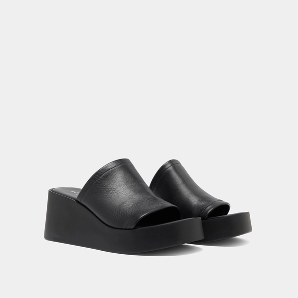 Wedge mules in black leather | EUGENE