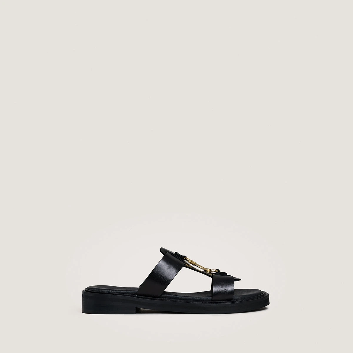 Mules with golden jaws in black leather | DOP