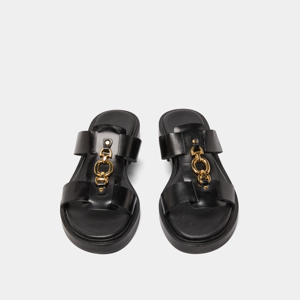 Mules with golden jaws in black leather | DOP