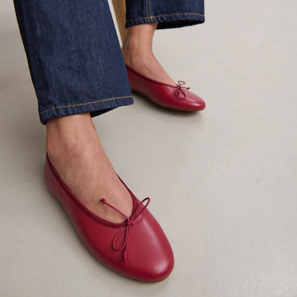 Ballet flats with laces in carmine red leather | DJERBA
