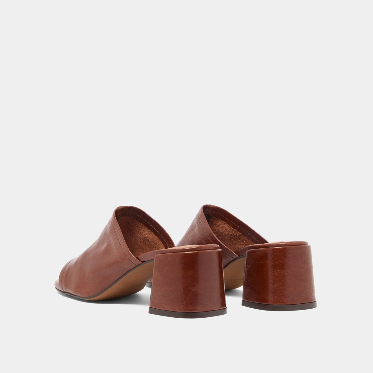 Mules with heels and open toes in brown distressed leather | BUTTERFLY