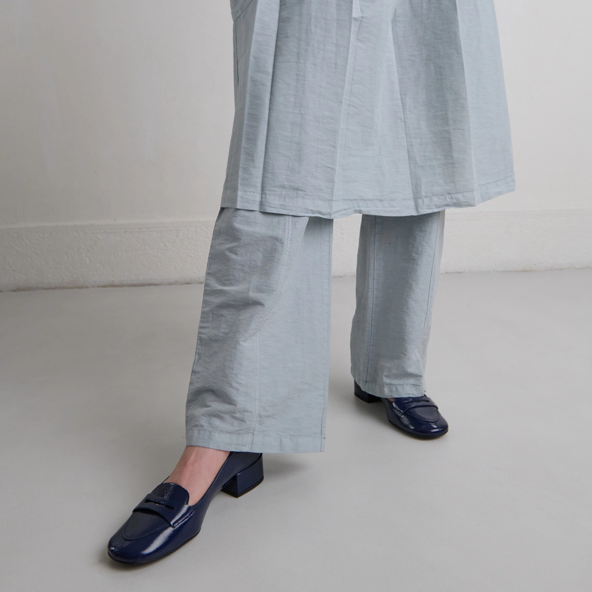 Low-heeled loafers in blue pleated patent | BERNIE