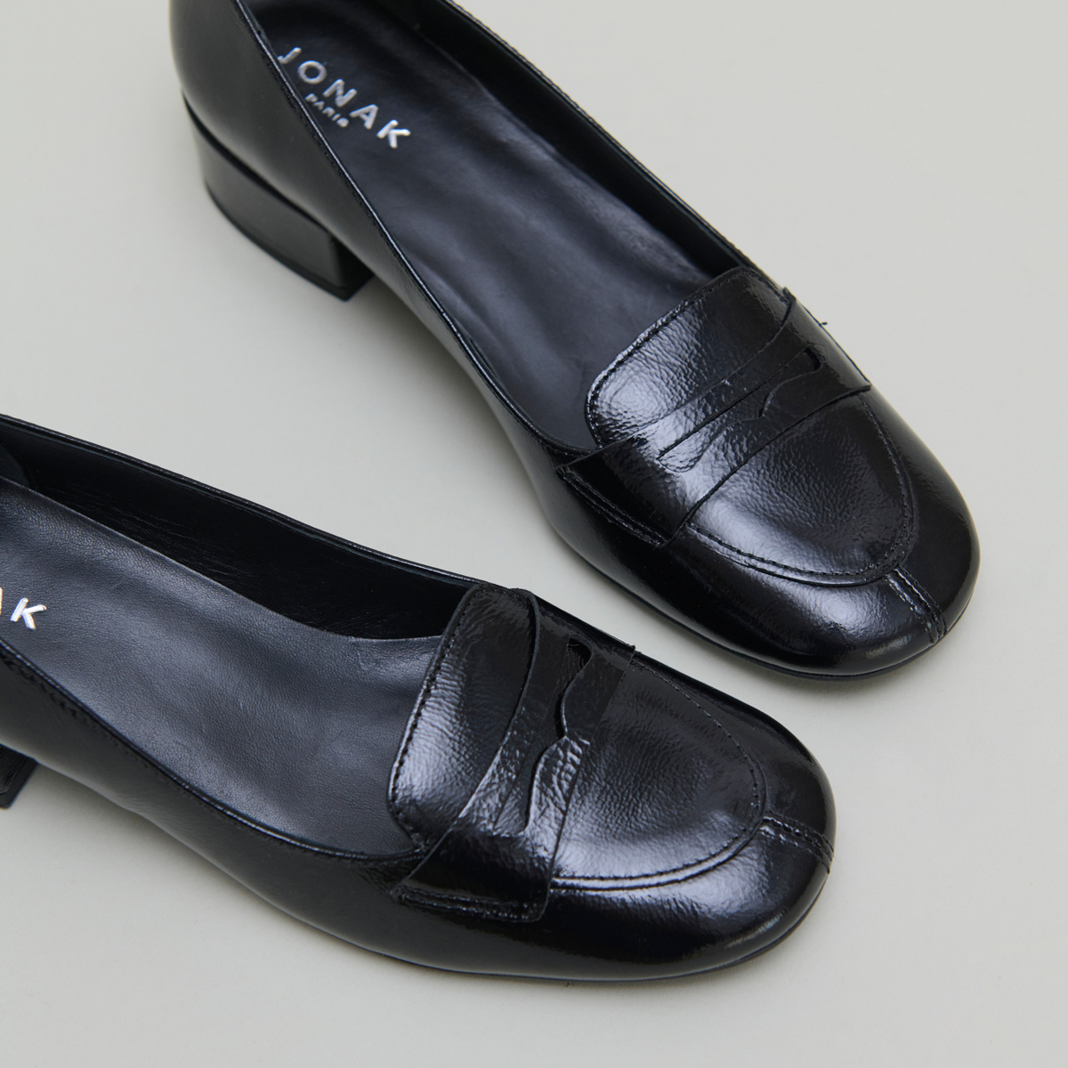 Low-heeled loafers in black pleated patent | BERNIE