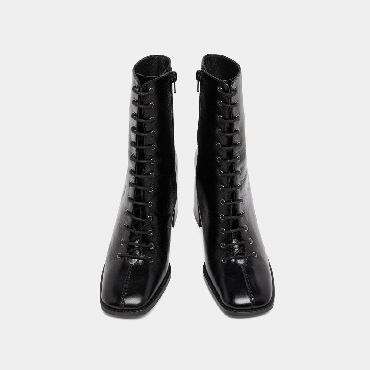 Heeled ankle boots with laces in black distressed leather | VANDELLE
