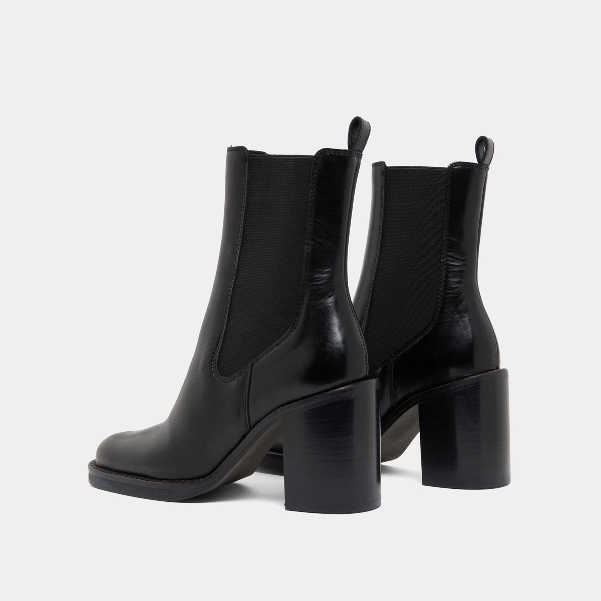 Ankle boots with overflowing heels in black leather | BRETZ