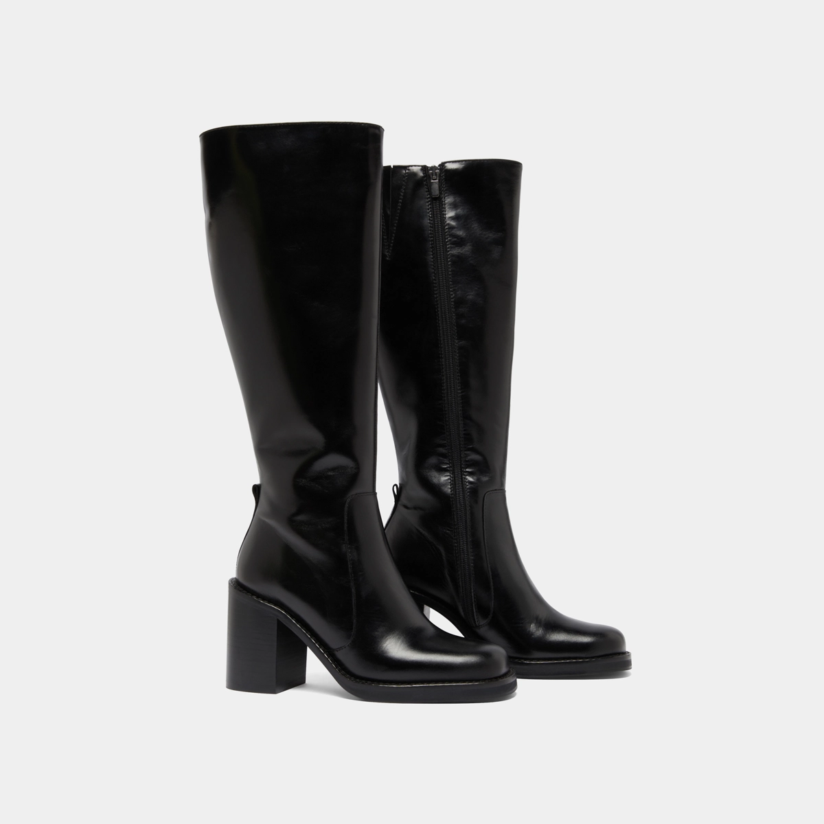Boots with overflowing heels in black leather | BRETZEL