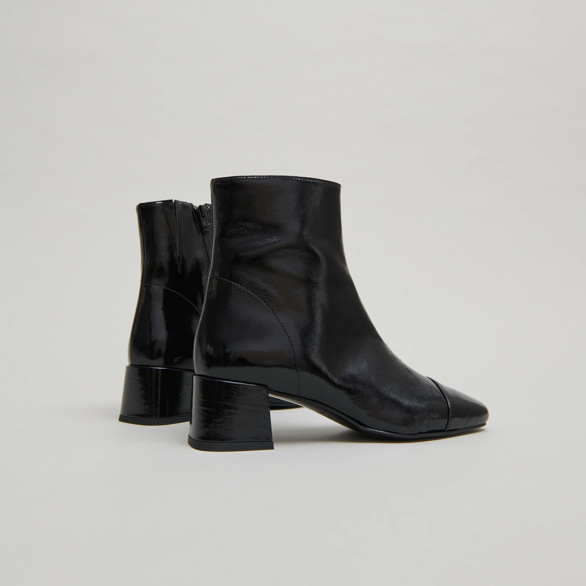 Ankle boots with zips in black pleated patent leather | DOMENICA