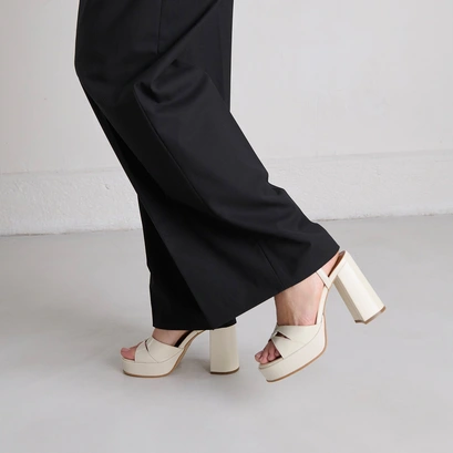 Platform sandals and high heels in ecru shiny leather | justine