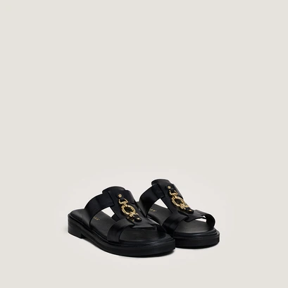 Mules with golden jaws in black leather | dop