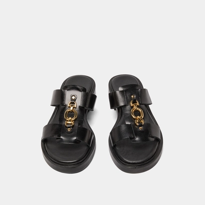 Mules with golden jaws in black leather | dop