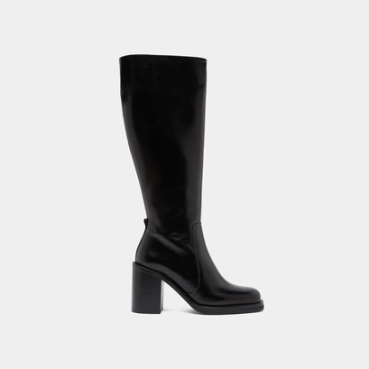 Boots with overflowing heels in black leather | bretzel
