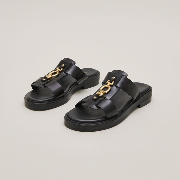 Mules with golden jaws in black leather | DOP