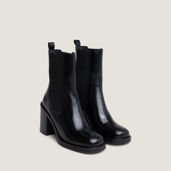 Ankle boots with overflowing heels in black leather | BRETZ