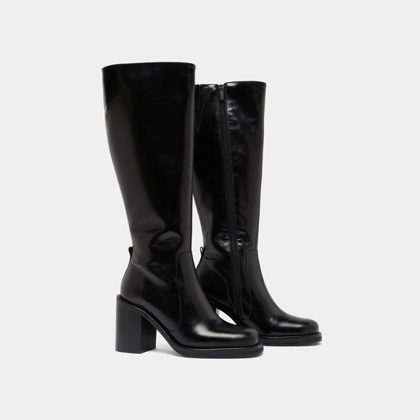 Boots with overflowing heels in black leather | BRETZEL